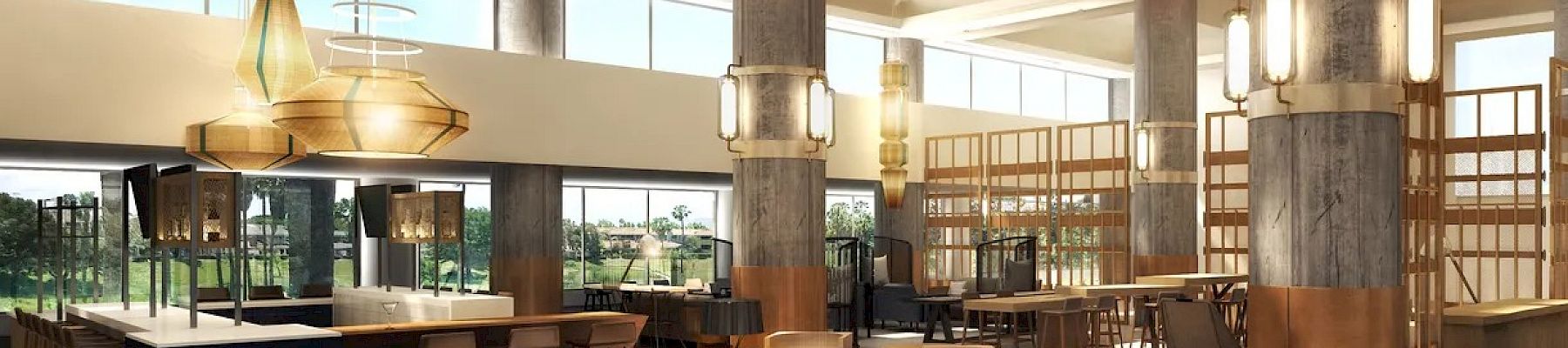 The image shows a spacious, modern lobby with large windows, contemporary furniture, wooden accents, and natural light streaming in, creating a welcoming ambiance.