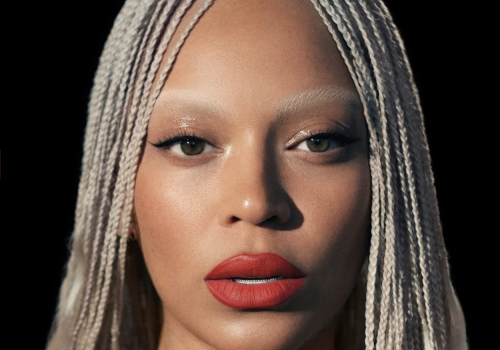 The image features a person with long braided hair and red lipstick. Text includes "Beyoncé Cowboy Carter Tour" and "Margot Bonvy Special Heal Review."
